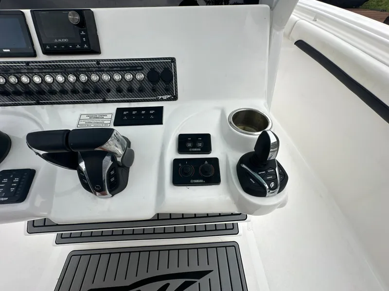Slide: The Image of Control panel of 2022 Tidewater 280 CC Adventure boat with joystick and throttle. - 16