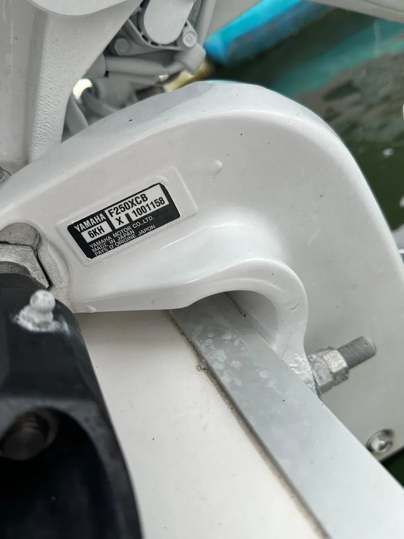 Slide: The Image of Close-up of Yamaha F250XCB engine on 2022 Tidewater 280 CC Adventure boat. - 28