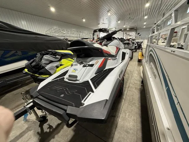 Slide: The Image of 2020 Yamaha Waverunner FX Cruiser HO in storage, surrounded by other watercraft. - 4