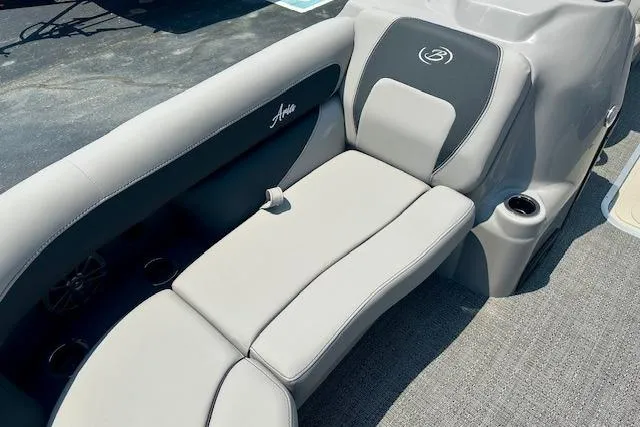 Slide: The Image of 2025 Barletta A22QC boat interior with gray seating and cup holder. - 3