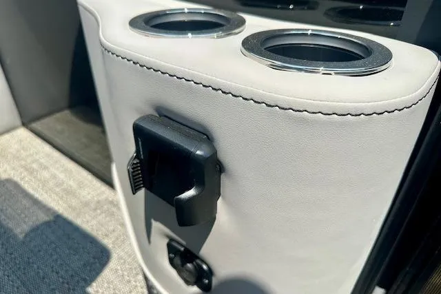 Slide: The Image of 2025 Barletta A22QC boat interior with dual cup holders and accessory mount. - 5