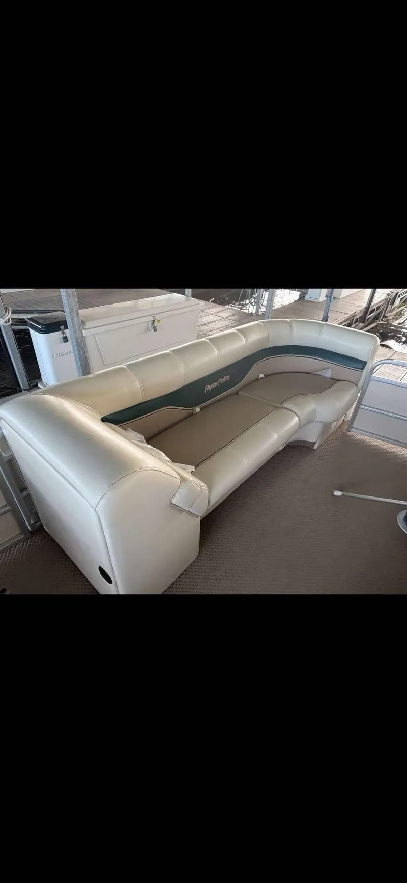 Slide: The Image of 2005 Godfrey AquaPatio 240 LE boat interior with beige seating. - 14