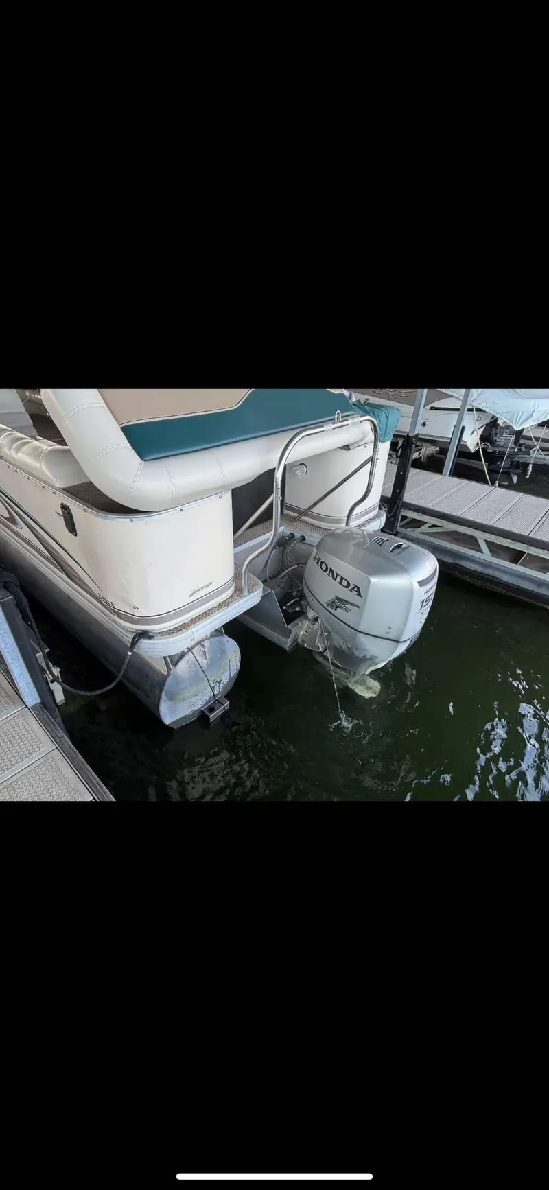 Slide: The Image of 2005 Godfrey AquaPatio 240 LE pontoon boat with Honda outboard motor at dock. - 18