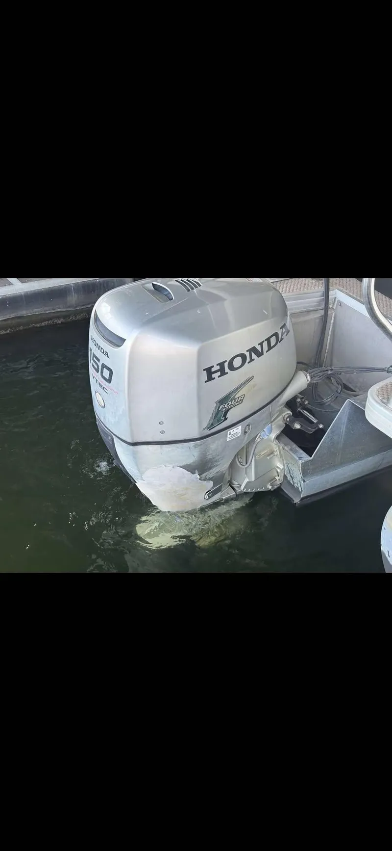 Slide: The Image of Honda outboard motor on 2005 Godfrey AquaPatio 240 LE pontoon boat. - 4