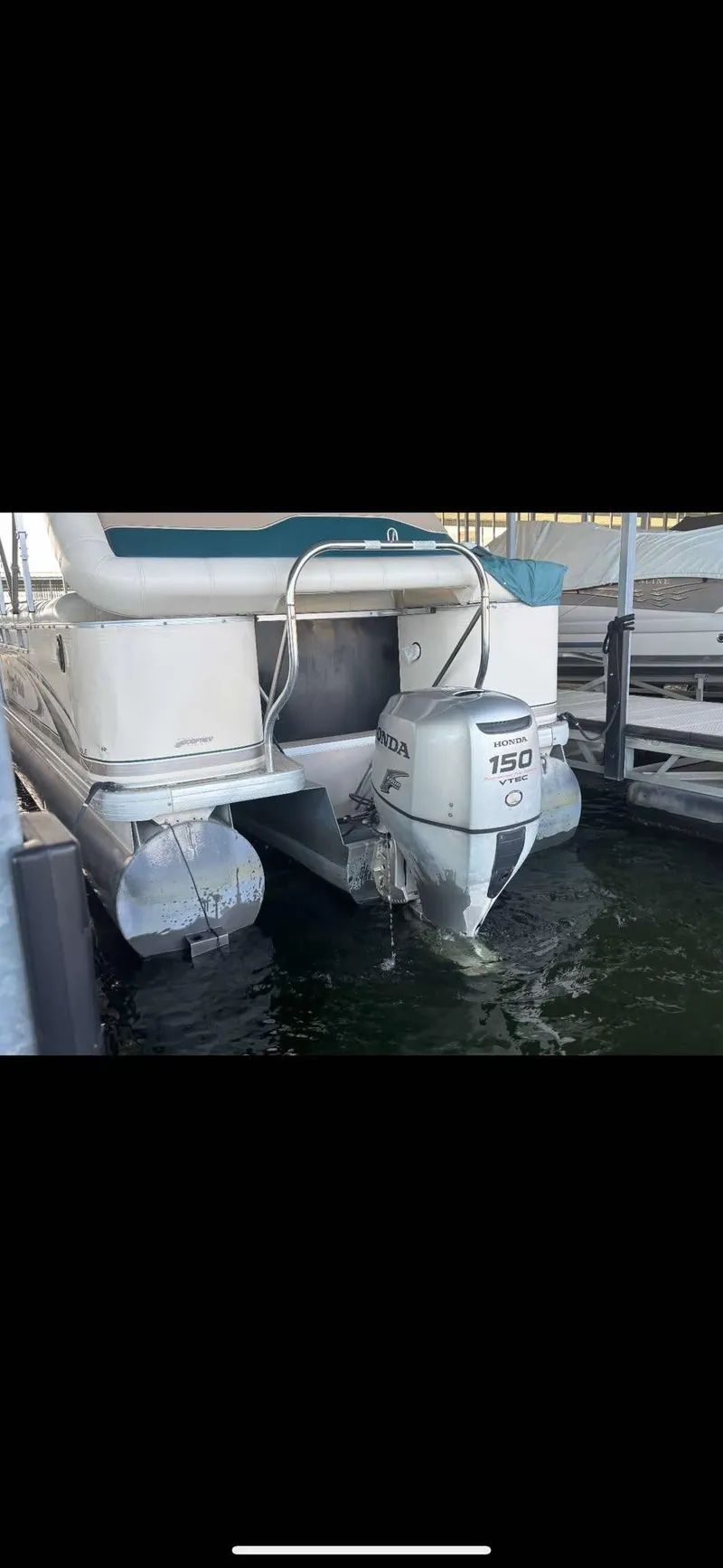 Slide: The Image of 2005 Godfrey AquaPatio 240 LE pontoon boat with 150 HP outboard motor. - 6