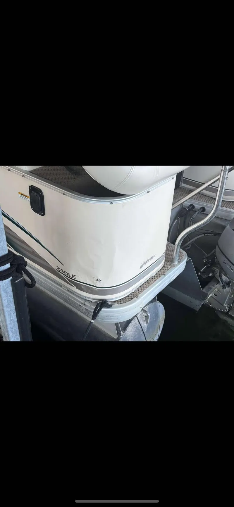 Slide: The Image of 2005 Godfrey AquaPatio 240 LE pontoon boat, partial view, docked. - 7