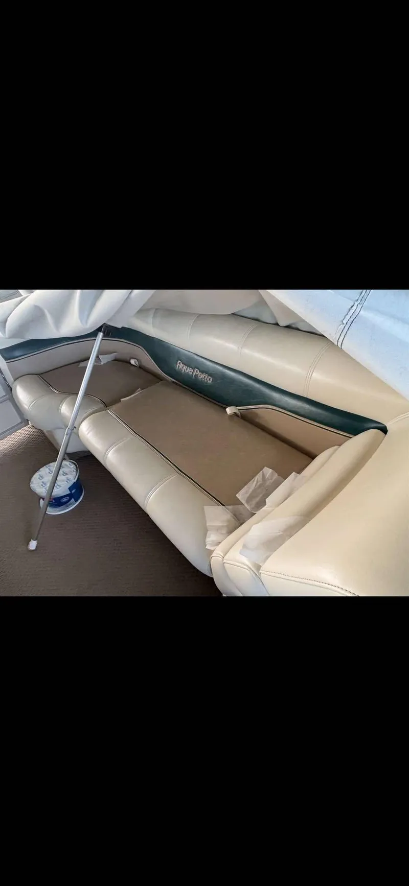 Slide: The Image of Interior of a 2005 Godfrey AquaPatio 240 LE pontoon boat with beige seating. - 9