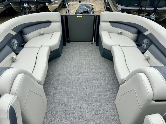 Slide: The Image of 2025 Barletta C22QC pontoon boat interior with plush seating and modern design. - 6