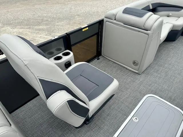 Slide: The Image of 2025 Barletta C22QC boat interior with gray seating and cup holders. - 7