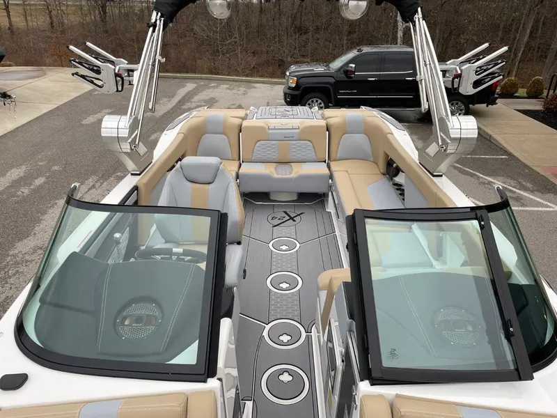 Slide: The Image of 2023 MasterCraft X24 boat interior with luxurious seating and modern design. - 12