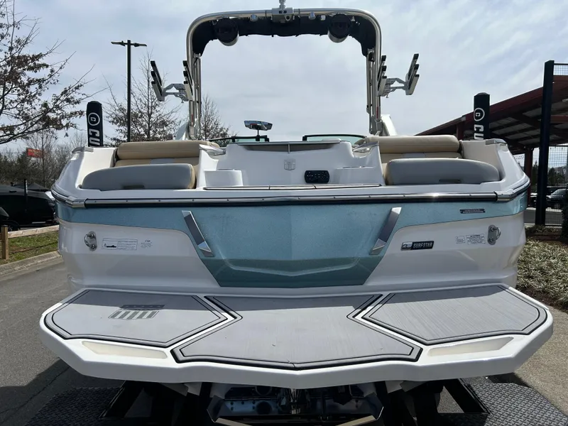 Slide: The Image of 2023 MasterCraft X24 boat, rear view, showcasing sleek design and modern features. - 5