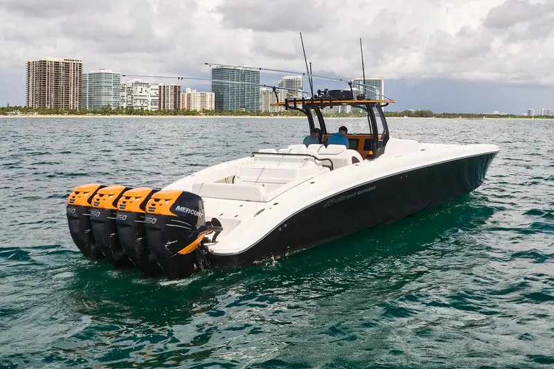 Slide: The Image of 2016 Midnight Express 43' Open boat with four engines on the water. - 10