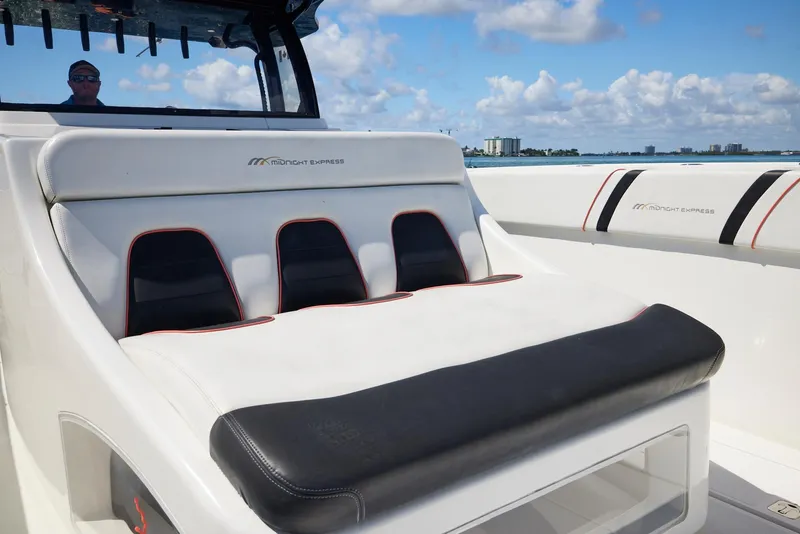 Slide: The Image of 2016 Midnight Express 43' Open boat interior with luxurious seating and ocean view. - 18