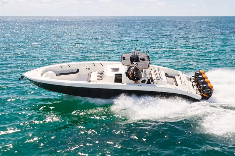 Slide: The Image of 2016 Midnight Express 43' Open boat cruising on the ocean. - 2