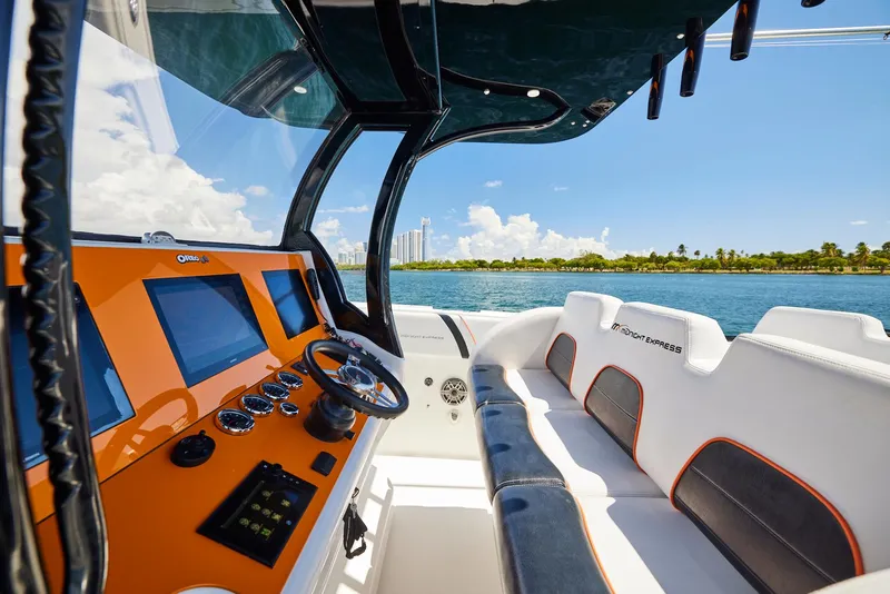 Slide: The Image of Interior view of 2016 Midnight Express 43' Open boat with modern dashboard and seating. - 23