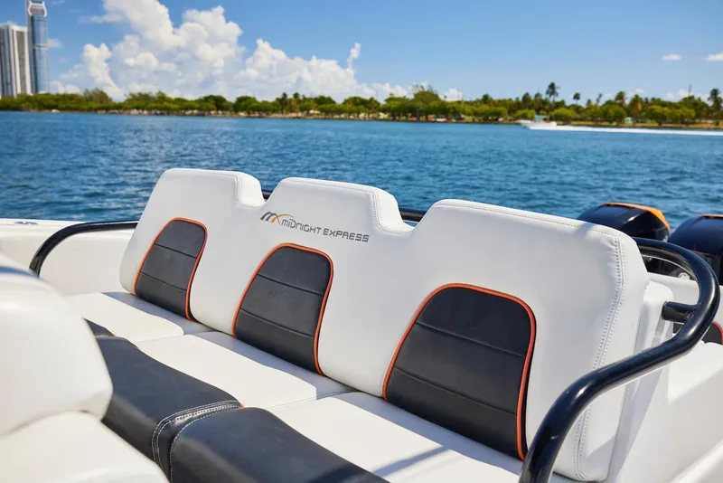 Slide: The Image of 2016 Midnight Express 43' Open boat seats with scenic water view. - 26