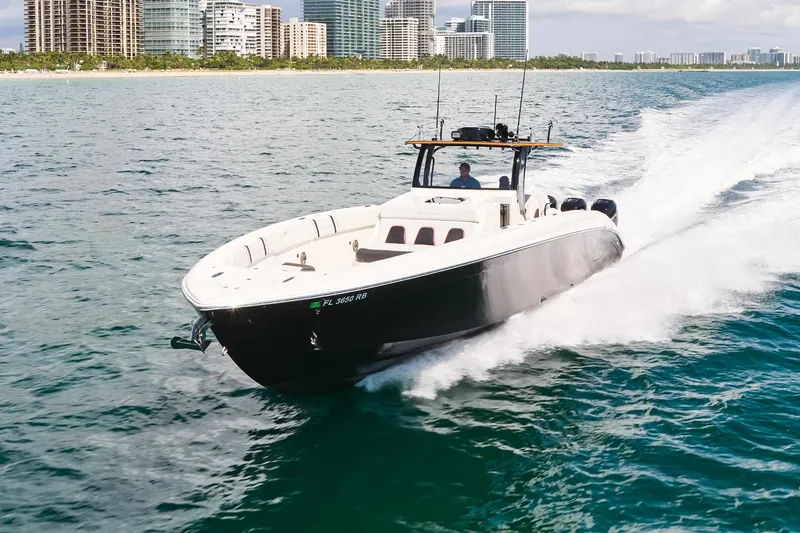 Slide: The Image of 2016 Midnight Express 43' Open boat cruising near city skyline. - 3