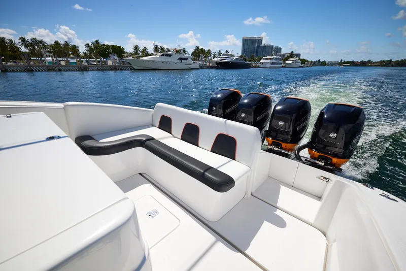 Slide: The Image of 2016 Midnight Express 43' Open boat with four powerful outboard engines on a sunny day. - 30