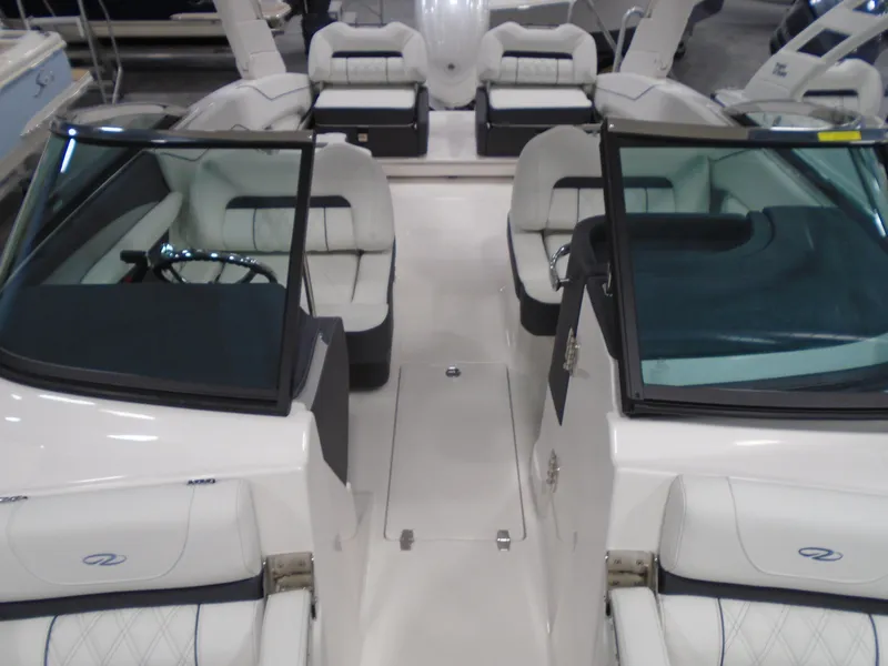 Slide: The Image of Interior view of 2025 Regal LX4 boat with luxurious seating and sleek design. - 14