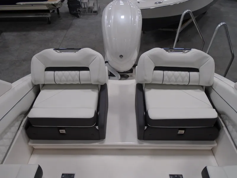 Slide: The Image of 2025 Regal LX4 boat interior with dual cushioned seats and sleek design. - 16