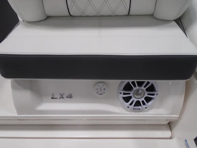 Slide: The Image of 2025 Regal LX4 boat interior with speaker and seating detail. - 7