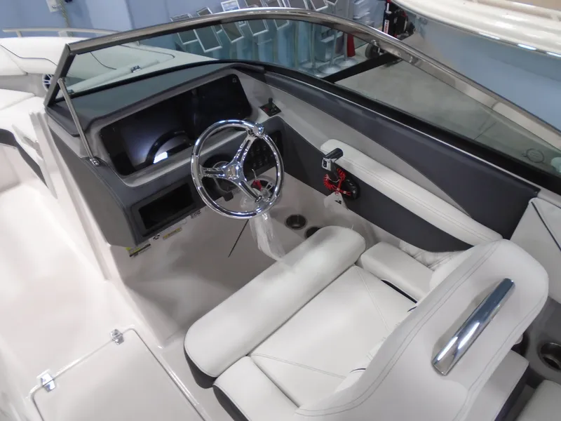 Slide: The Image of 2025 Regal LX4 boat interior with sleek steering wheel and modern dashboard design. - 9