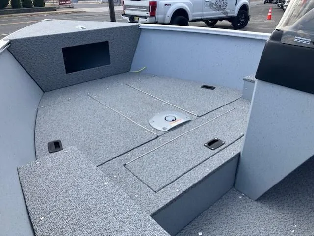 Slide: The Image of 2025 Lund 1600 Fury SS boat interior with spacious deck and storage compartments. - 5