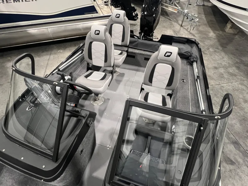 Slide: The Image of 2025 Princecraft Holiday 162 WS MAX boat interior with four seats and windshield. - 11
