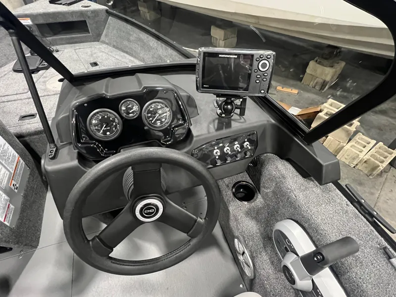 Slide: The Image of 2025 Princecraft Holiday 162 WS MAX boat dashboard with steering wheel and navigation system. - 12