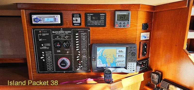 Slide: The Image of Control panel of a 1988 Island Packet 38 sailboat with navigation and communication equipment. - 12