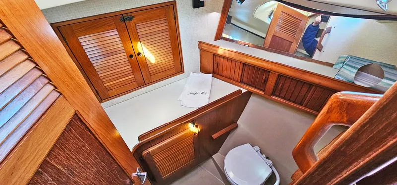 Slide: The Image of Bathroom interior of 1988 Island Packet 38 yacht with wooden cabinetry and fixtures. - 8