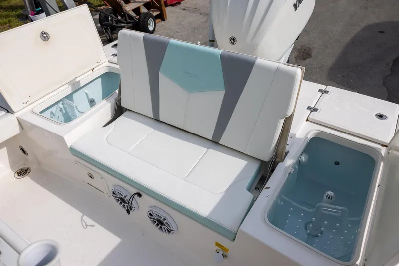 Slide: The Image of 2023 Robalo 246 Cayman boat interior with seating and storage compartments. - 10