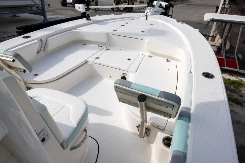 Slide: The Image of 2023 Robalo 246 Cayman boat interior with seating and storage compartments. - 13