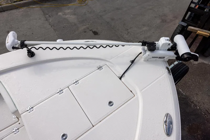 Slide: The Image of 2023 Robalo 246 Cayman boat deck with trolling motor and storage compartments. - 14