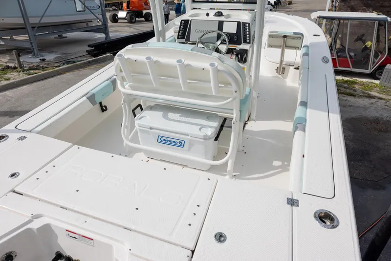 Slide: The Image of 2023 Robalo 246 Cayman boat interior with seating and storage. - 7