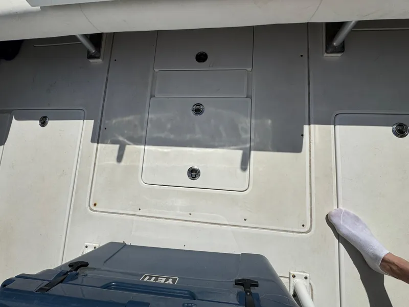 Slide: The Image of Deck of a 1996 Intrepid 356 Cuddy boat with a Yeti cooler. - 11