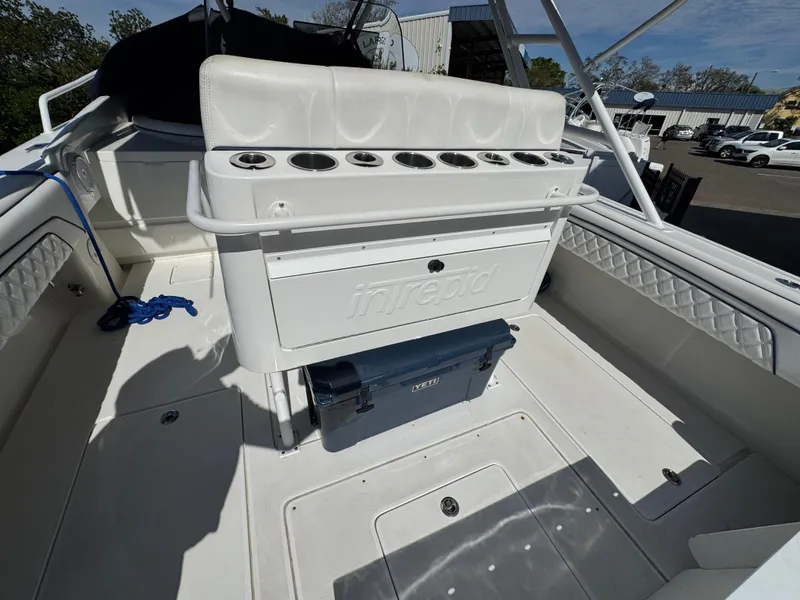 Slide: The Image of 1996 Intrepid 356 Cuddy boat interior with seating and storage compartments. - 14