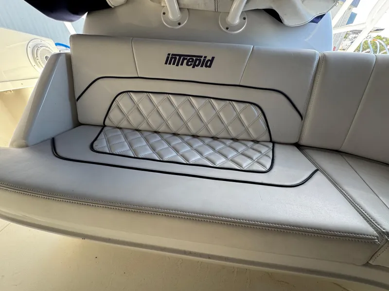 Slide: The Image of Intrepid 356 Cuddy 1996 boat seat with quilted design and logo. - 20