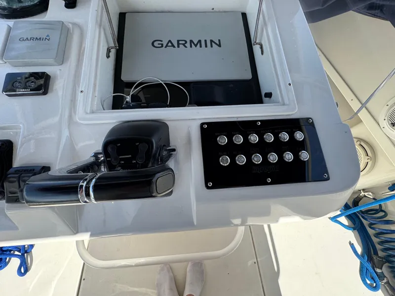 Slide: The Image of Control panel of a 1996 Intrepid 356 Cuddy boat with Garmin navigation system. - 22