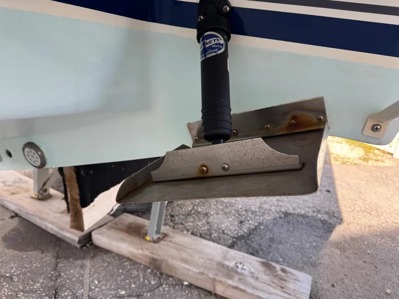Slide: The Image of 1996 Intrepid 356 Cuddy boat trim tab and hydraulic actuator detail. - 24