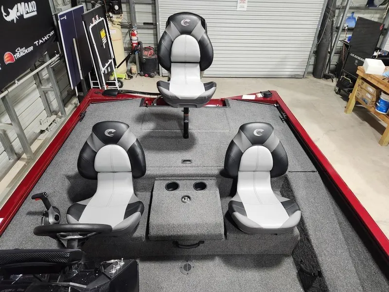 Slide: The Image of 2024 Crestliner XF 189 boat interior with three seats in a garage setting. - 10