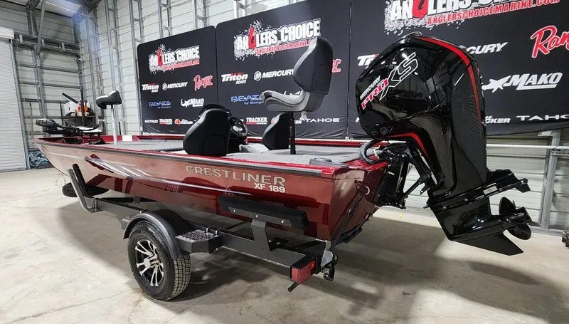 Slide: The Image of 2024 Crestliner XF 189 boat with powerful outboard motor in showroom setting. - 3