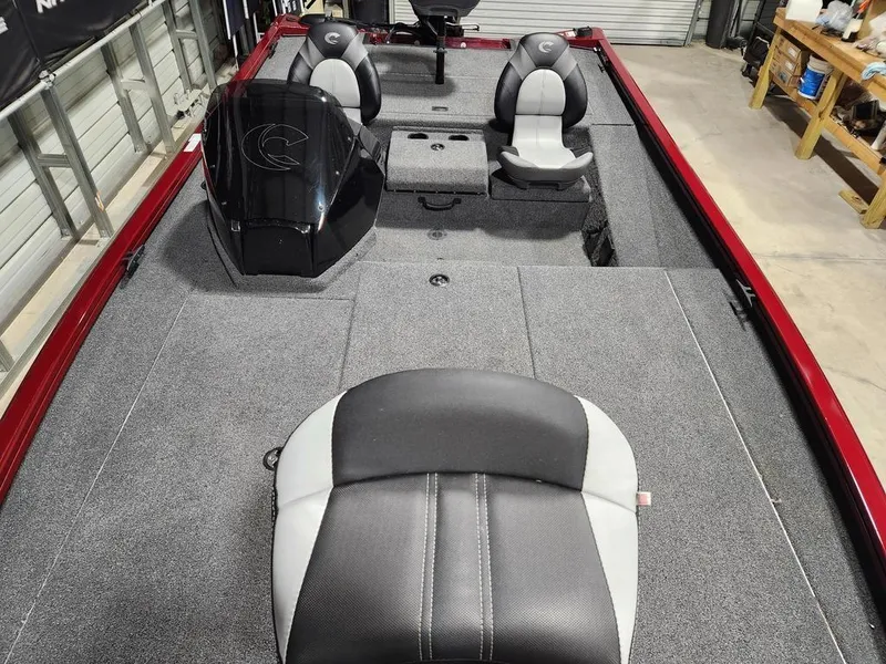 Slide: The Image of 2024 Crestliner XF 189 boat interior with gray and black seating, spacious deck. - 9