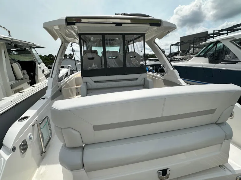 Slide: The Image of 2025 Tiara Yachts 34 LS luxury boat interior with sleek seating and modern design. - 15