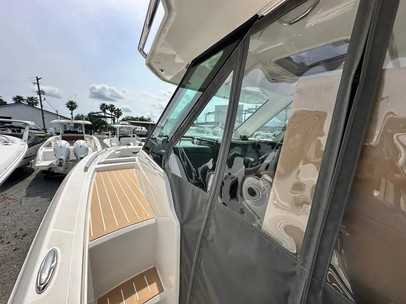 Slide: The Image of 2025 Tiara Yachts 34 LS boat, side view with sleek design and modern features. - 21