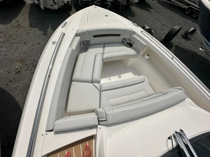 Slide: The Image of 2025 Tiara Yachts 34 LS boat with spacious white seating area and modern design. - 23