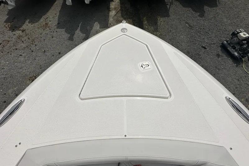 Slide: The Image of 2025 Tiara Yachts 34 LS boat deck, featuring sleek design and textured surface. - 24