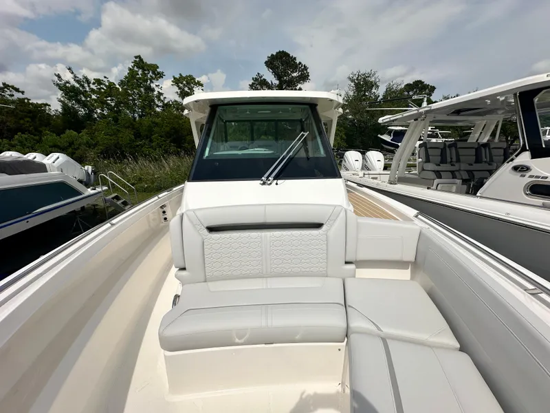 Slide: The Image of 2025 Tiara Yachts 34 LS boat with sleek design and comfortable seating. - 25