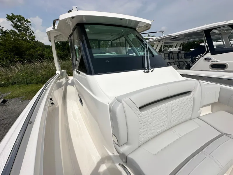 Slide: The Image of 2025 Tiara Yachts 34 LS boat with sleek design and comfortable seating. - 26