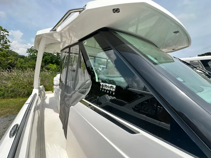 Slide: The Image of 2025 Tiara Yachts 34 LS, sleek design, side view, modern luxury boat. - 27